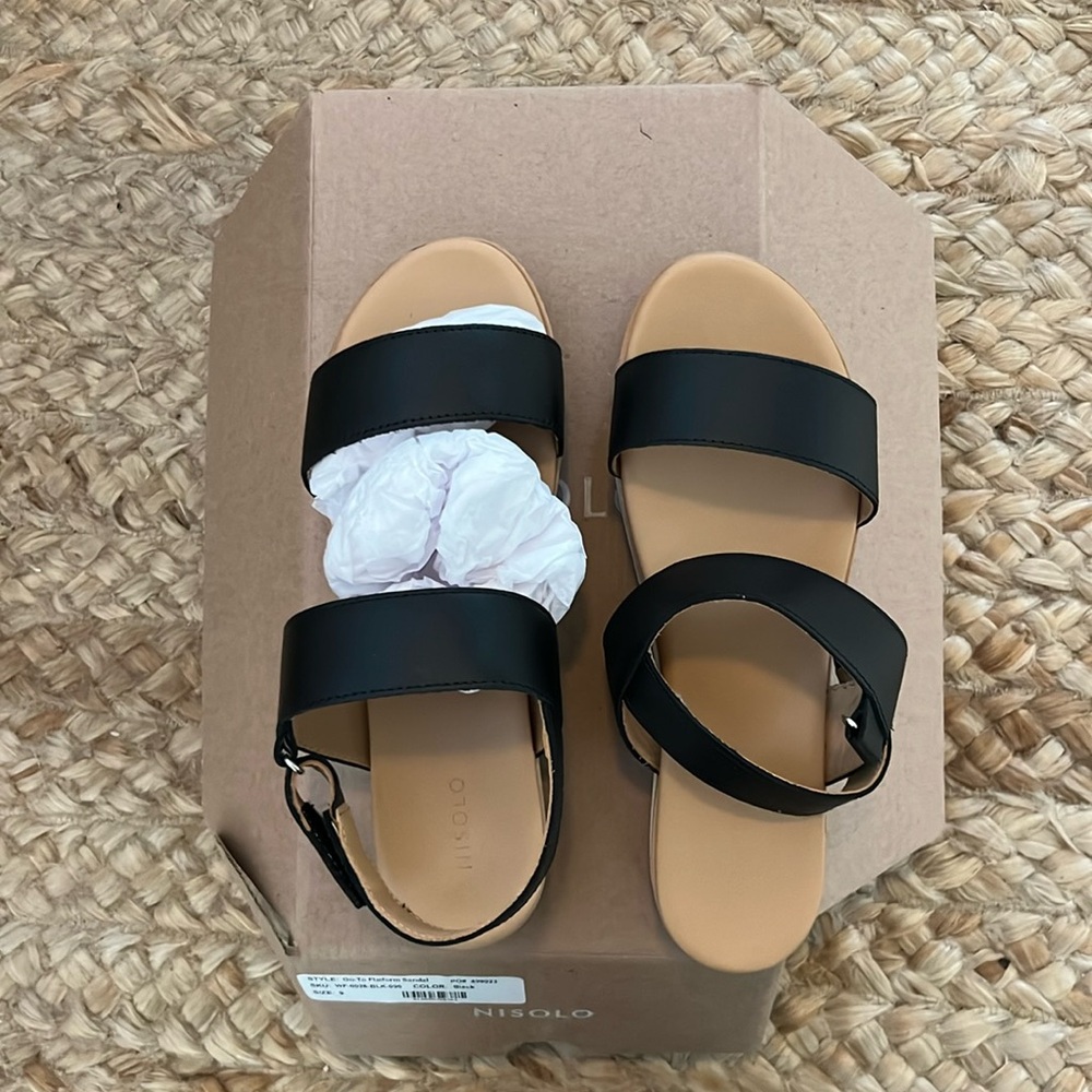 Nisolo Platform sandal Black and Tan. Never worn,they were too big.